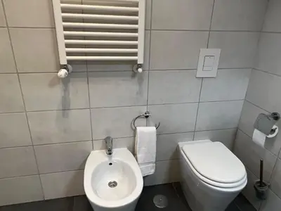 a small bathroom with a toilet and a sink at Residenza Monteverde in Rome