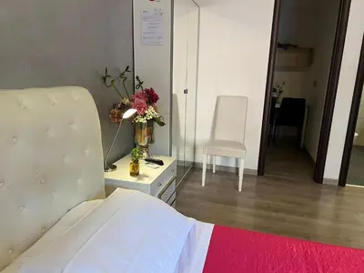 a hospital room with a bed and a vase of flowers at Residenza Monteverde in Rome