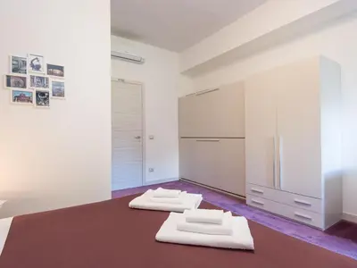 a kitchen with two white towels on the floor at Guesthouse Park Pines in Rome
