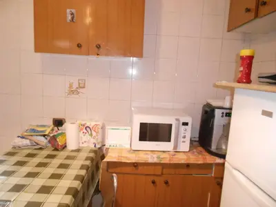 a kitchen with a microwave on top of a counter at Casa di Roma in Rome