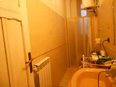 a small bathroom with a toilet and a sink at Casa di Roma in Rome