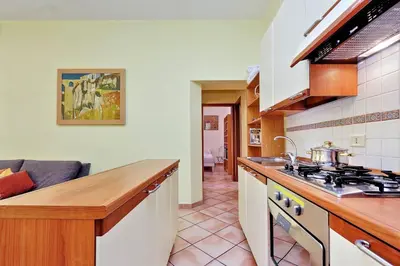 a kitchen with a sink and a stove top oven at Romalibera in Rome