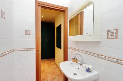 a bathroom with a sink and a mirror at Romalibera in Rome