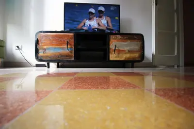 a dresser with a tv on top of it at Apartment Ostiense Piramide Station in Rome