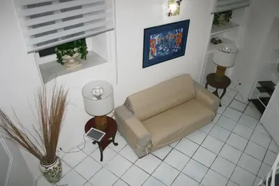 a living room with a couch and a window at Foro Romano Apartments A in Rome