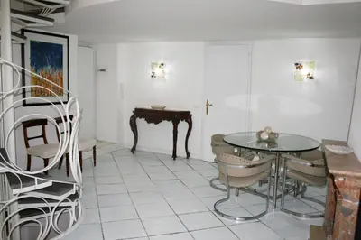 a dining room with a table and chairs at Foro Romano Apartments A in Rome