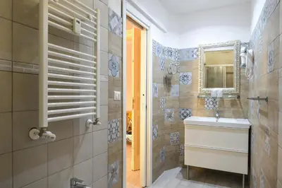 a bathroom with a sink and a mirror at Vatican Nausicaa in Rome