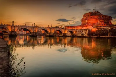 a bridge over a river with a building at Vatican Nausicaa in Rome