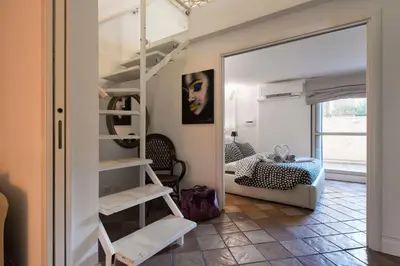 a room with a bunk bed and a bedroom at Casale 2.0 in Rome