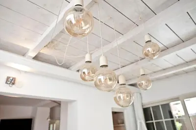 a group of glass bulbs hanging from a ceiling at Casale 2.0 in Rome