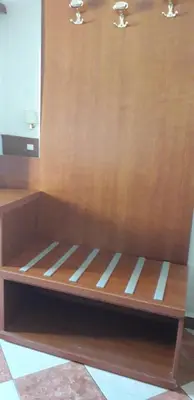 a wooden shelf in a room with a wooden wall at Filiberto Apartment in Rome
