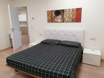 a bedroom with a black and white checkered bed at Vetere 101 Apartment in Rome