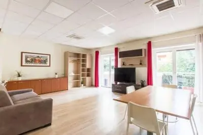 a living room with a table and a couch at Vetere 101 Apartment in Rome