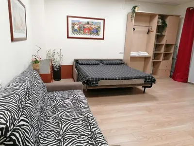 a room with a bed and a couch in it at Vetere 101 Apartment in Rome