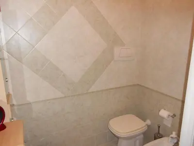 a bathroom with a toilet and a sink at Your secret place in Rome in Rome