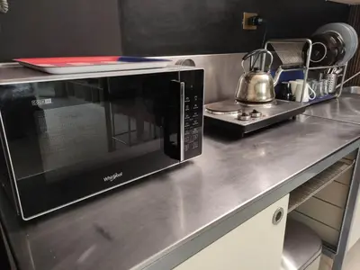 a microwave oven sitting on a counter in a kitchen at Your secret place in Rome in Rome