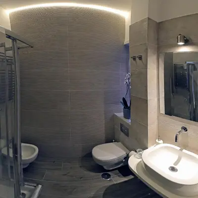 a bathroom with a toilet and a sink at Antinori Vatican Suite in Rome