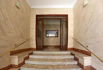 a staircase in a building with a glass door at Antinori Vatican Suite in Rome
