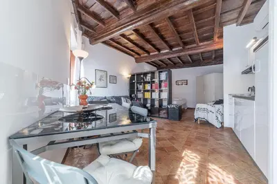 a living room with a table and chairs at Black White - FromHometoRome in Rome