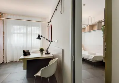 a home office with a desk and a chair at Camplus Pietralata - Casa per Ferie in Rome