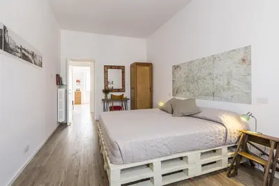 a bedroom with a bed with a map on the wall at Casa Vacanza 