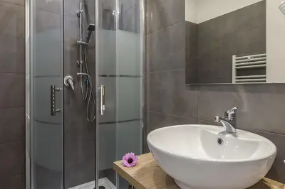 a bathroom with a sink and a shower at La Palma in Rome