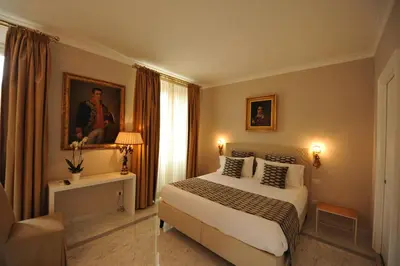 a hotel room with a bed and a window at Angel Spagna Suite in Rome
