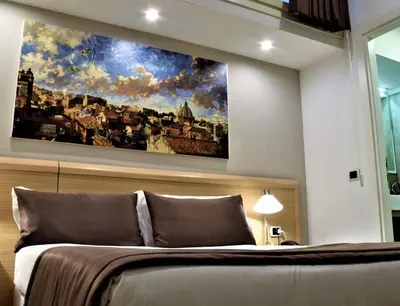 a bedroom with a large painting above a bed at Hotel Paolo II in Rome