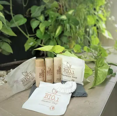 a group of three bottles of botin products on a table at Hotel Paolo II in Rome