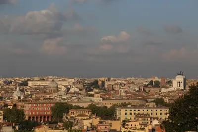 a view of a city with buildings and a cloudy sky at Dhome B&B in Rome