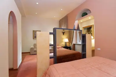 a bedroom with two beds and a bunk bed at Rome in your heart - Spagna apartment in Rome