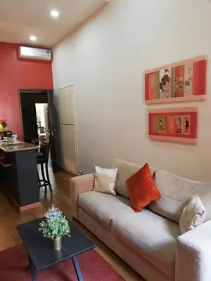 a living room with a couch and a table at Rome in your heart - Spagna apartment in Rome