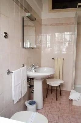 a bathroom with a sink and a toilet at Casa per Ferie Ravasco San Pietro in Rome