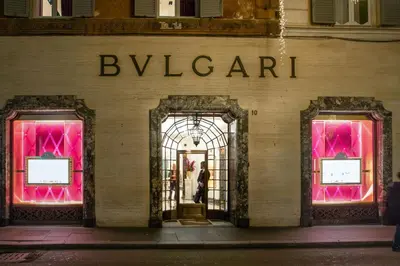 a man walks past the entrance to a bulkin store at Spagna Secret Rooms in Rome
