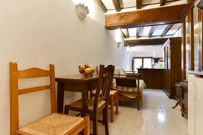 a kitchen and dining room with a table and chairs at Loft Pantheon in Rome