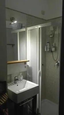 a bathroom with a sink and a shower at Elion in Rome