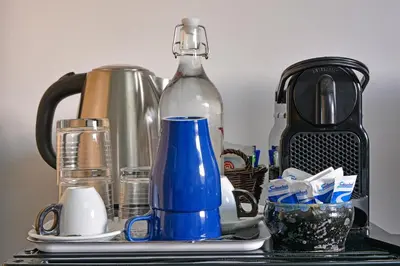a counter top with a coffee maker and a blender at Elion in Rome