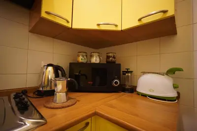 a kitchen counter with a toaster and a toaster and a blender at MGPgroup Guest House Navona 2 in Rome
