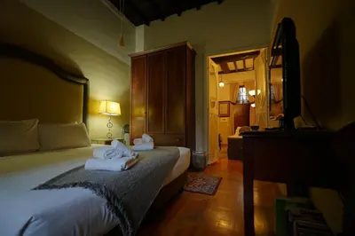 a bedroom with a bed with towels on it at MGPgroup Guest House Navona 2 in Rome
