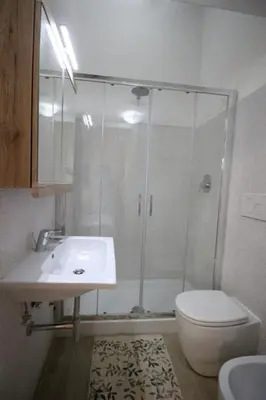 a bathroom with a shower and a sink and a toilet at Patrizi 2/a in Rome