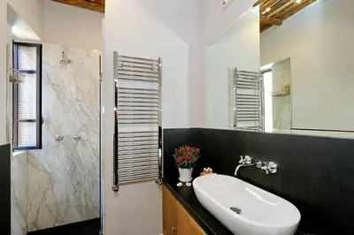 a bathroom with a sink and a shower at Spectacular Luxury Flat in Trastevere in Rome