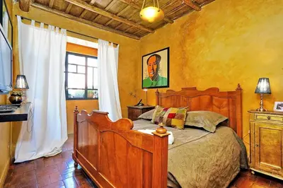 a bedroom with a wooden bed and a window at Spectacular Luxury Flat in Trastevere in Rome