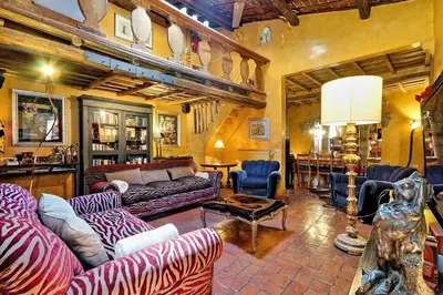 a living room with couches and chairs and a table at Spectacular Luxury Flat in Trastevere in Rome
