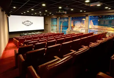 an auditorium with brown chairs and a projection screen at Harry's Bar Trevi Hotel & Restaurant in Rome
