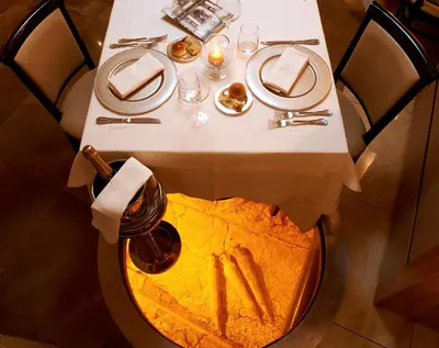 a table with a white table cloth on a table with food at Harry's Bar Trevi Hotel & Restaurant in Rome
