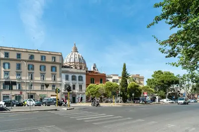 a city street with a building and a domed building at Vatican Stemar Apartment in Rome