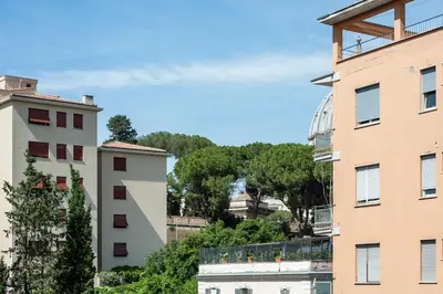 a group of buildings with trees in the background at Vatican Stemar Apartment in Rome
