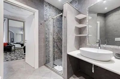 a bathroom with a sink and a shower at Maison Degli Artisti Suites in Rome