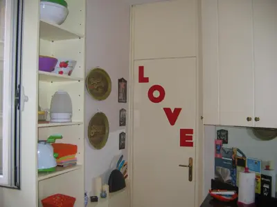a room with a door with the word love on it at MGPgroup Have a Nice Day in Rome