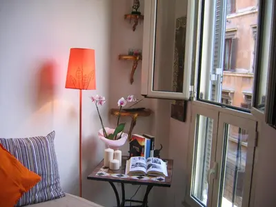 a bedroom with a table with a bed and a window at MGPgroup Have a Nice Day in Rome